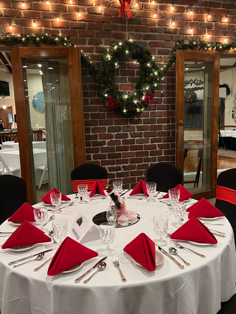 Table in our gallery room set for a holiday party